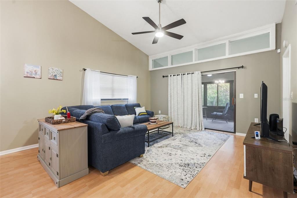 7650 Forest Trail, Unit 6 Port Richey, FL 34668 - Photo 15 of 37 a living room with furniture and window