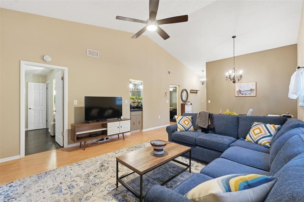7650 Forest Trail, Unit 6 Port Richey, FL 34668 - Photo 16 of 37 a living room with furniture and a flat screen tv