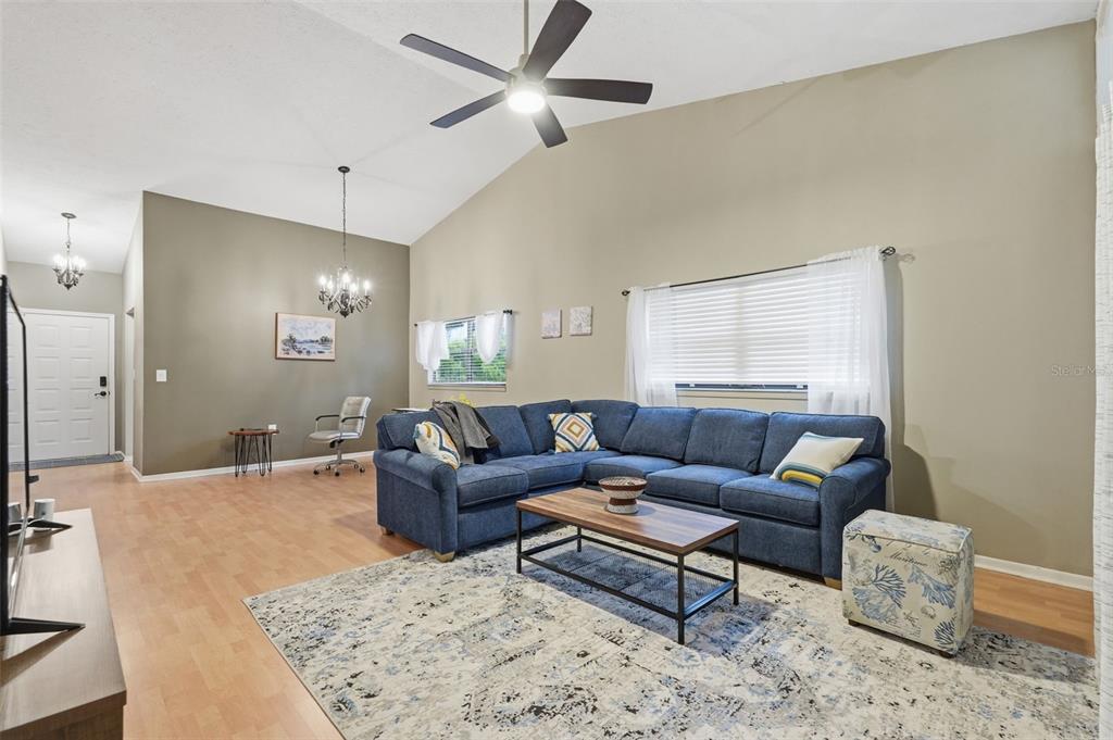 7650 Forest Trail, Unit 6 Port Richey, FL 34668 - Photo 18 of 37 a living room with furniture and a wooden floor