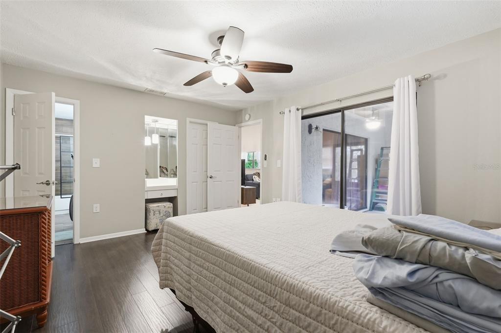 7650 Forest Trail, Unit 6 Port Richey, FL 34668 - Photo 20 of 37 a living room with furniture and wooden floor