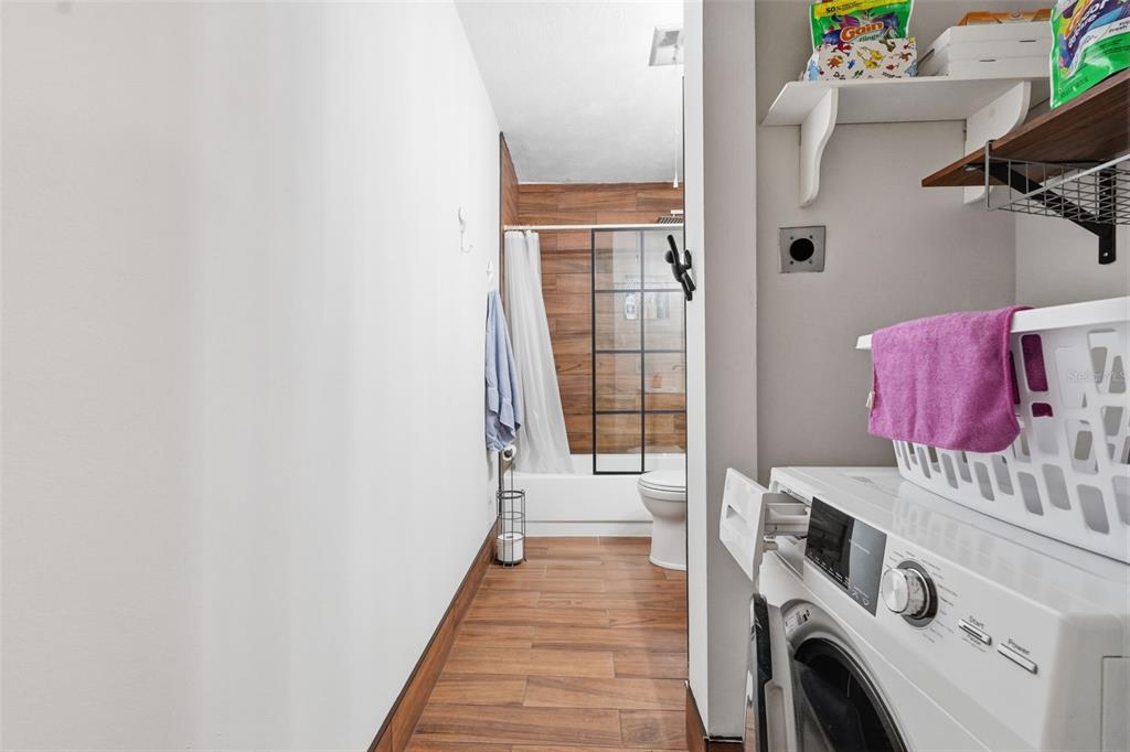 7650 Forest Trail, Unit 6 Port Richey, FL 34668 - Photo 26 of 37 a view of a hallway with washer and dryer