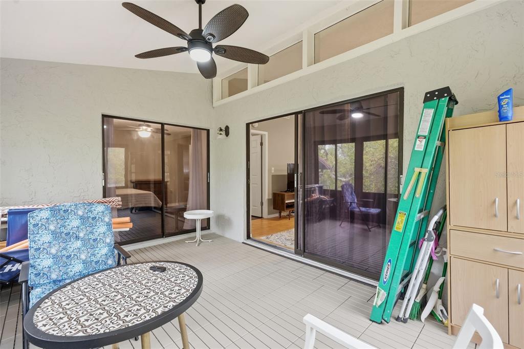 7650 Forest Trail, Unit 6 Port Richey, FL 34668 - Photo 29 of 37 a living room with furniture and a floor to ceiling window