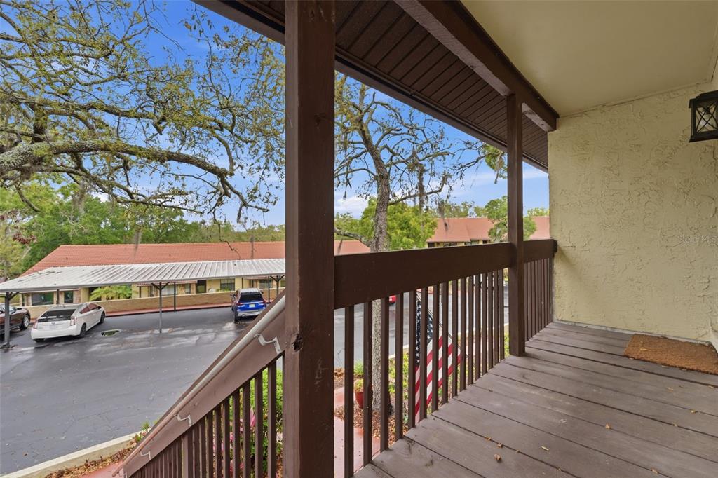 7650 Forest Trail, Unit 6 Port Richey, FL 34668 - Photo 3 of 37 a view of a city from a balcony