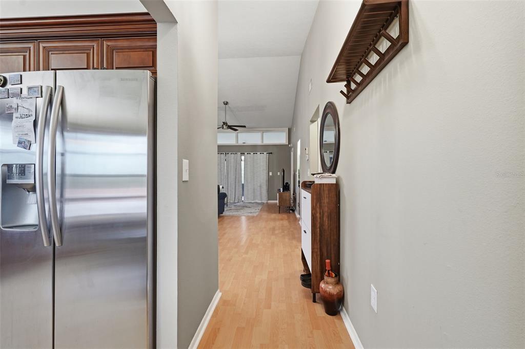 7650 Forest Trail, Unit 6 Port Richey, FL 34668 - Photo 6 of 37 a view of a hallway with wooden floor