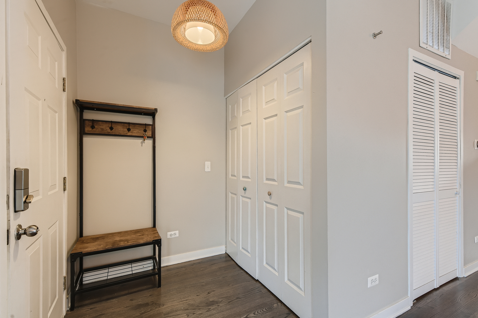 1318 West Grenshaw Street, Unit B Chicago, IL 60607 - Photo 3 of 16 a view of a hallway with wooden floor and staircase