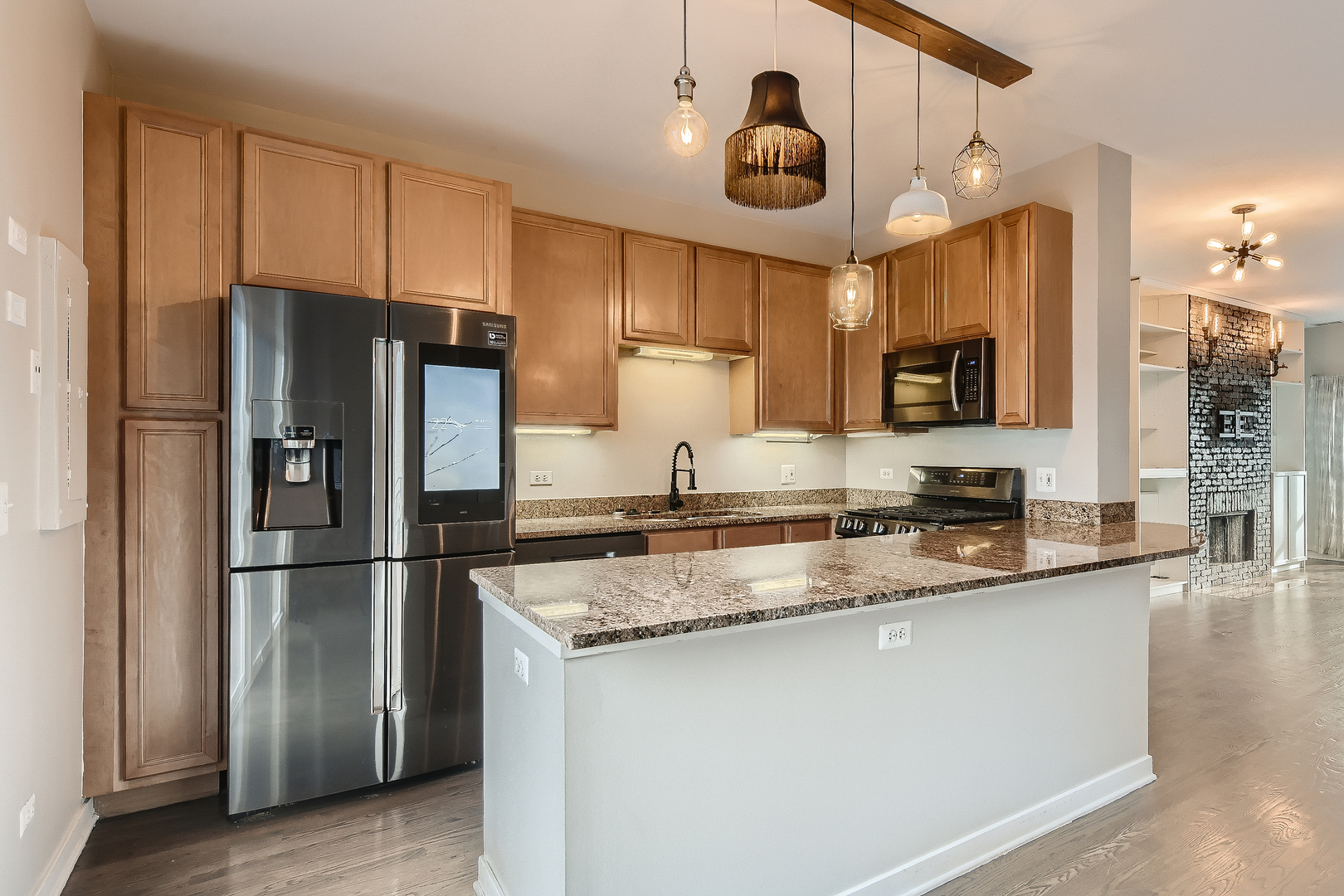 1318 West Grenshaw Street, Unit B Chicago, IL 60607 - Photo 6 of 16 a kitchen with granite countertop a refrigerator a sink and cabinets