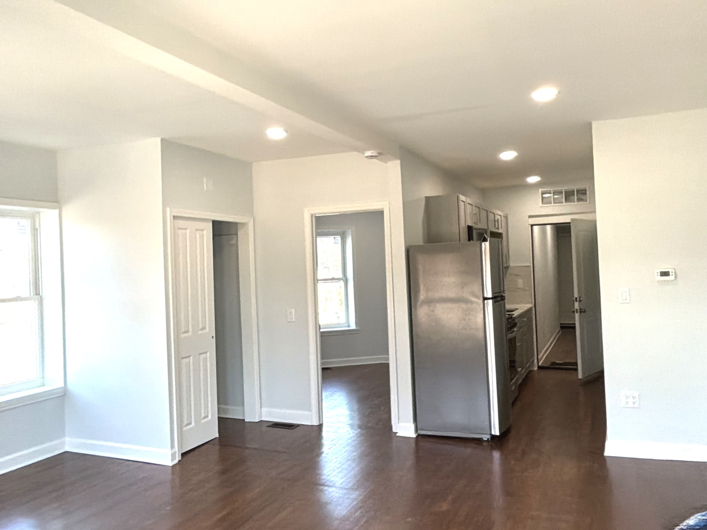 224 East Cass Street, Unit 2R Joliet, IL 60432 - Photo 4 of 24 a view of a kitchen with a refrigerator and wooden floor