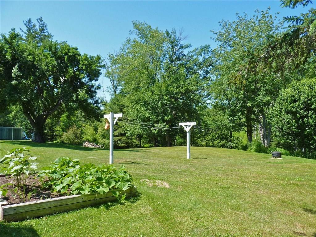 1081 Shore Road Lamoine, ME 04605 - Photo 7 of 35 Back yard with raised garden bed.