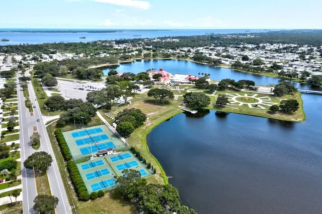 an aerial view of a houses with city view