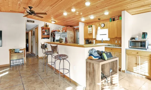 a very nice looking kitchen with a large window