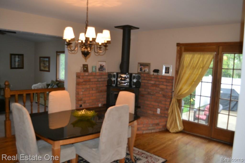 716 Dressler Lane Rochester, MI 48307 - Photo 7 of 17 Wood burning stove in dining room