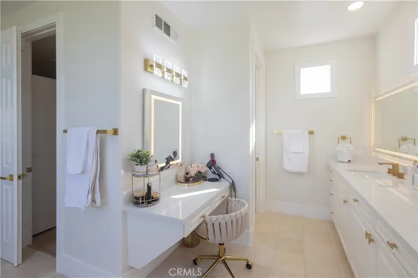 a view of bathroom with dual sinks