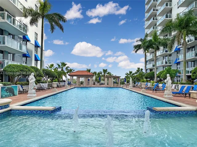 a view of a swimming pool with a patio