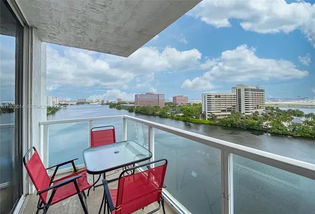a balcony with an outdoor seating
