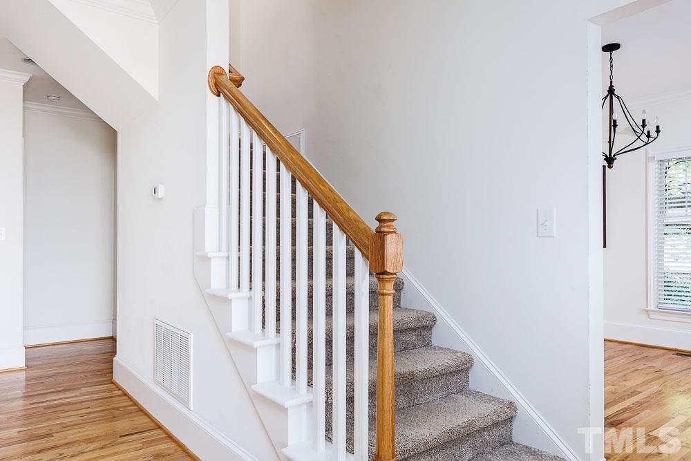 6814 Gloucester Road Raleigh, NC 27612 - Photo 20 of 35 a view of entryway and hall with wooden floor