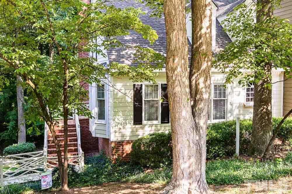 6814 Gloucester Road Raleigh, NC 27612 - Photo 2 of 35 front view of a house with a tree