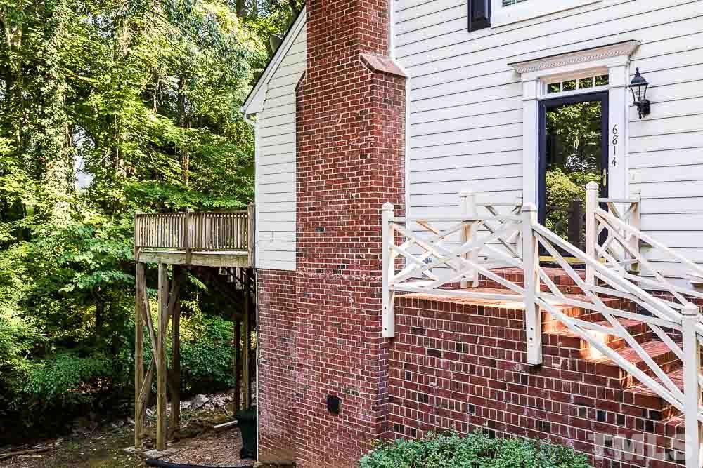 6814 Gloucester Road Raleigh, NC 27612 - Photo 33 of 35 a view of a house with a yard