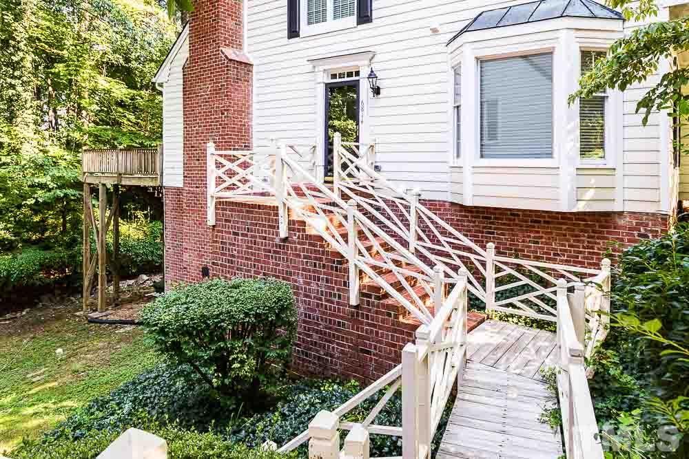6814 Gloucester Road Raleigh, NC 27612 - Photo 34 of 35 a view of a brick house with a large windows