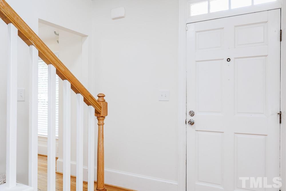6814 Gloucester Road Raleigh, NC 27612 - Photo 4 of 35 a view of entryway with wooden floor