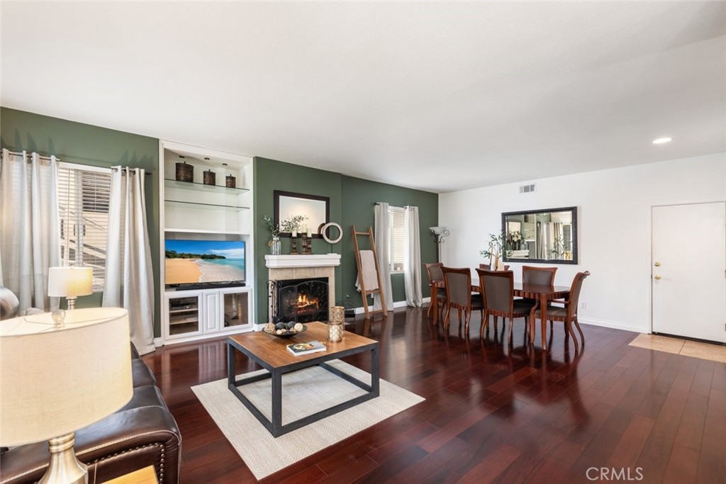 1430 Baldwin Drive Corona, CA 92881 - Photo 18 of 61 a living room with furniture a fireplace and a window