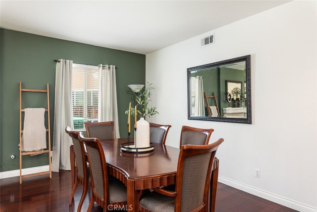 1430 Baldwin Drive Corona, CA 92881 - Photo 19 of 61 a view of a dining room with furniture window and wooden floor