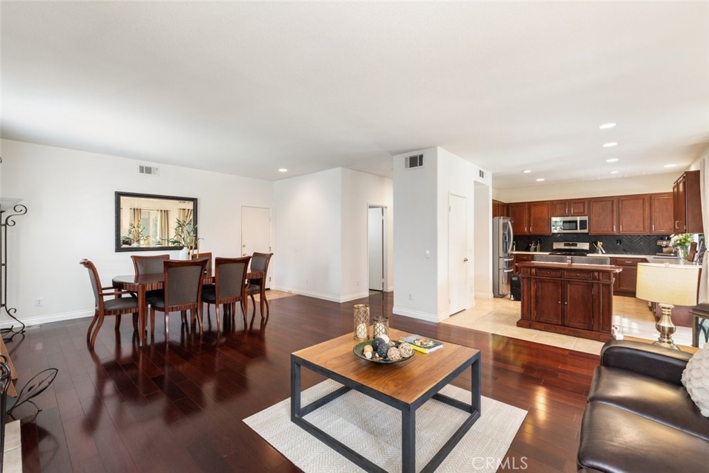 1430 Baldwin Drive Corona, CA 92881 - Photo 20 of 61 a living room with furniture kitchen view and a dining table