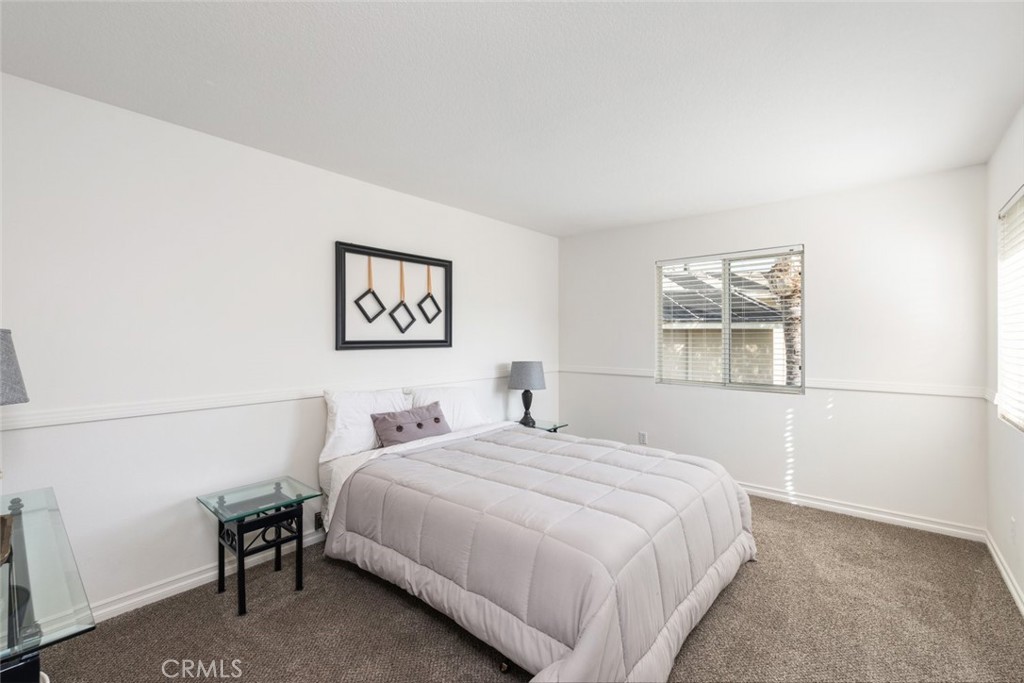 1430 Baldwin Drive Corona, CA 92881 - Photo 26 of 61 a bedroom with a bed and a window