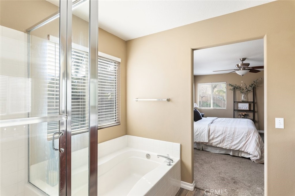 1430 Baldwin Drive Corona, CA 92881 - Photo 30 of 61 a bedroom with a bed and a large window