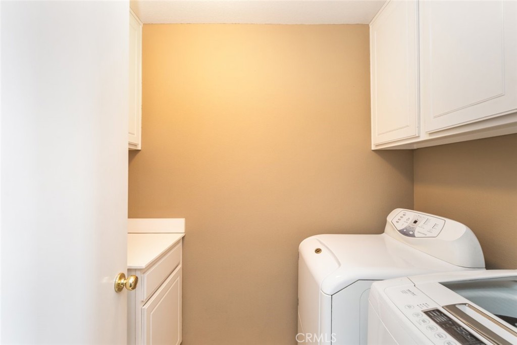 1430 Baldwin Drive Corona, CA 92881 - Photo 32 of 61 The convenient laundry room offers ample storage with built-in cabinets and counter space.