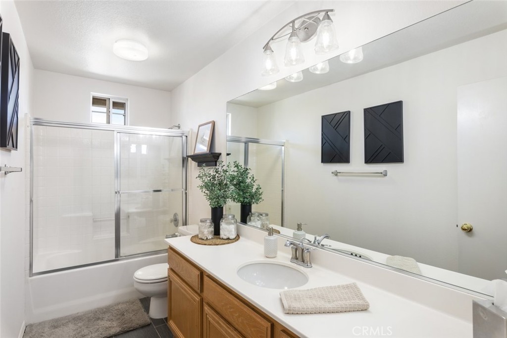 1430 Baldwin Drive Corona, CA 92881 - Photo 34 of 61 a bathroom with a sink a toilet and shower