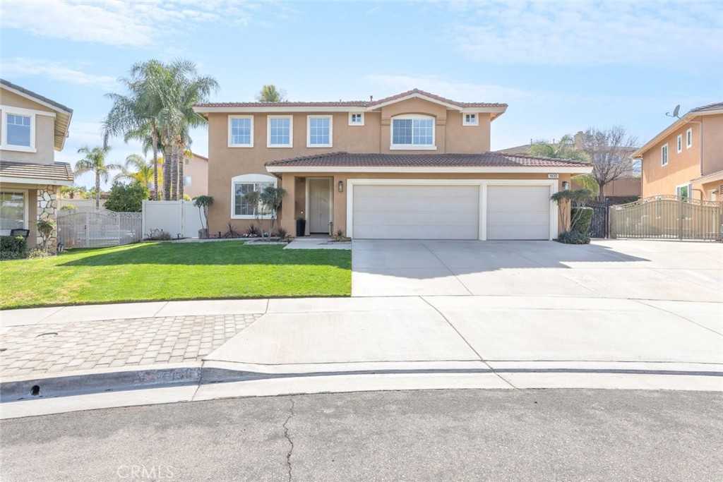 1430 Baldwin Drive Corona, CA 92881 - Photo 4 of 61 a view of a yard in front of a brick house with a small yard
