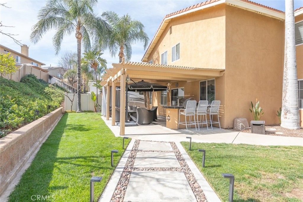 1430 Baldwin Drive Corona, CA 92881 - Photo 41 of 61 a front view of a house with a garden and patio