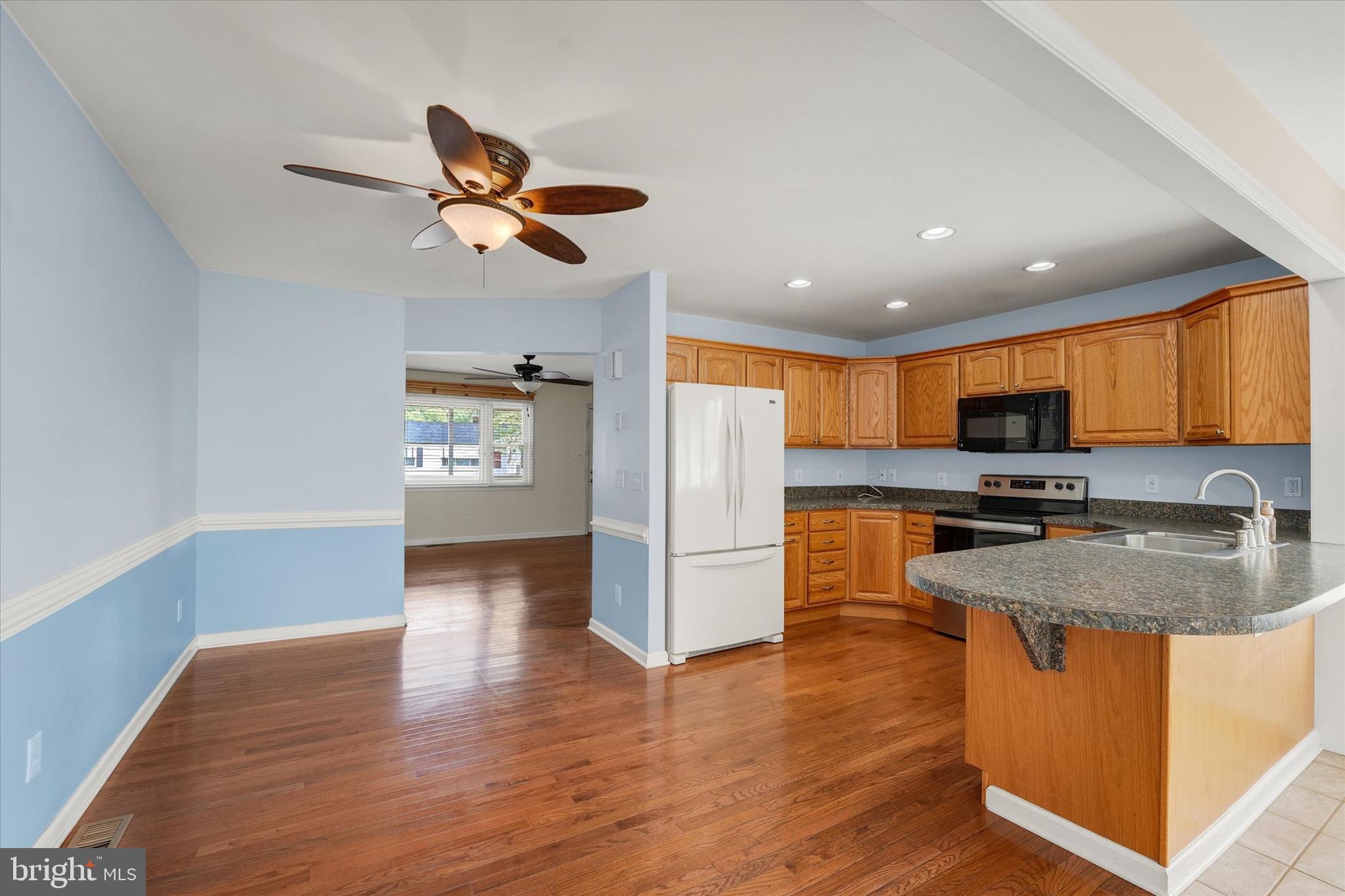 4 Rene Carr Street Elkton, MD 21921 - Photo 9 of 44 Eat-In Area and Hardwood Flooring in Kitchen