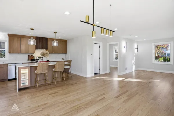 a kitchen with a refrigerator and a sink