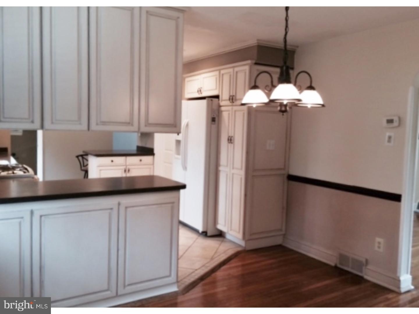 737 Hilltop Road Springfield, PA 19064 - Photo 12 of 24 a kitchen with stainless steel appliances granite countertop a refrigerator a sink and a white cabinets