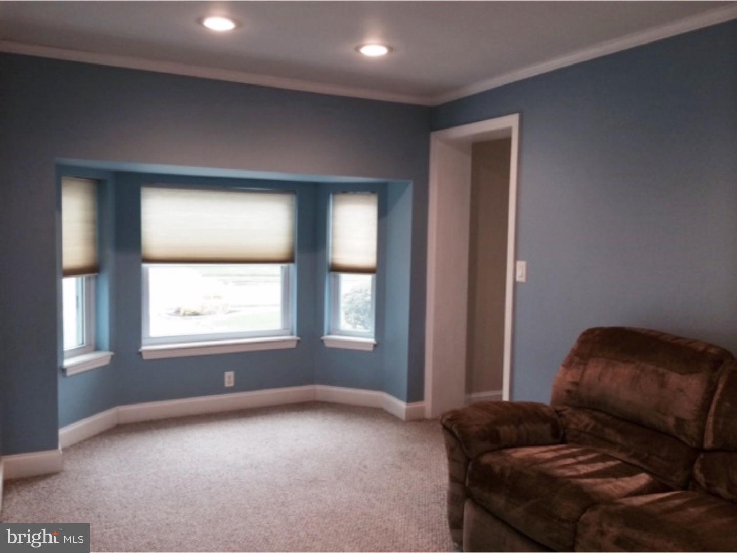 737 Hilltop Road Springfield, PA 19064 - Photo 13 of 24 a living room with furniture and a window