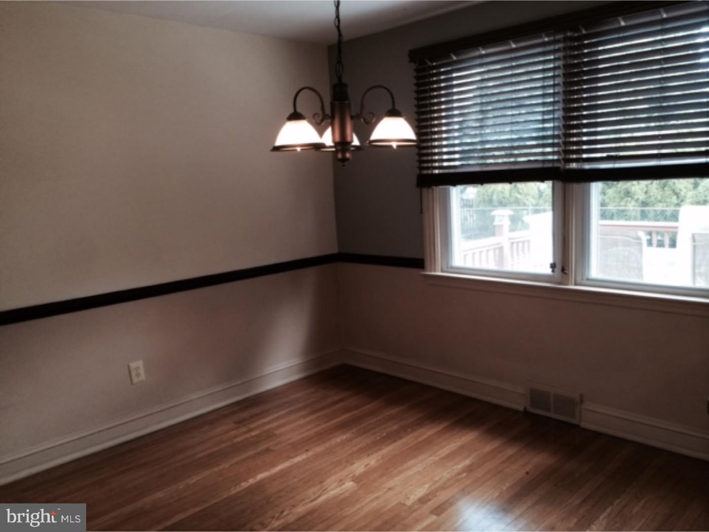 737 Hilltop Road Springfield, PA 19064 - Photo 6 of 24 a view of a room with wooden floor and a window