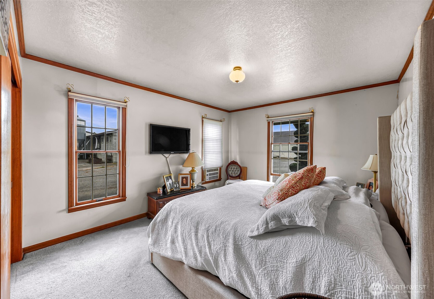 8634 Double Ditch Road Lynden, WA 98264 - Photo 10 of 40 a bedroom with a bed and a flat screen tv
