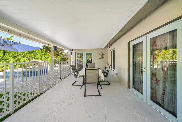 a balcony with furniture and garden view