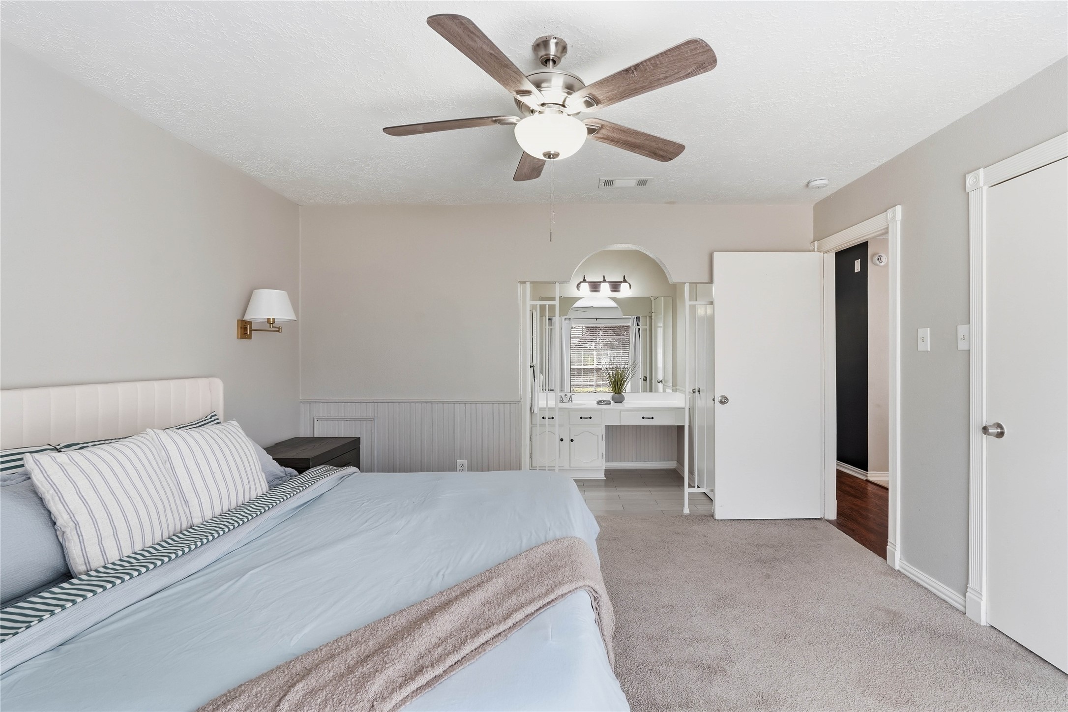 4506 Pineville Lane Spring, TX 77388 - Photo 21 of 33 a bedroom with a large bed and a ceiling fan
