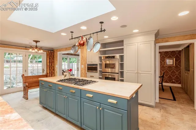 a living room with furniture fireplace and a large window