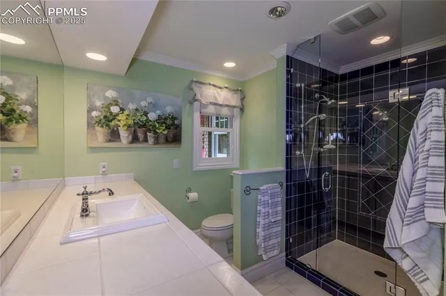a kitchen with a stove refrigerator and a fireplace