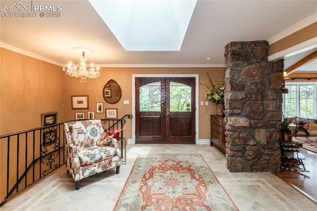 a bed sitting in a spacious bedroom next to a window