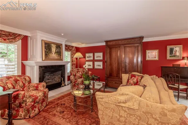 a view of a dining room with furniture and chandelier