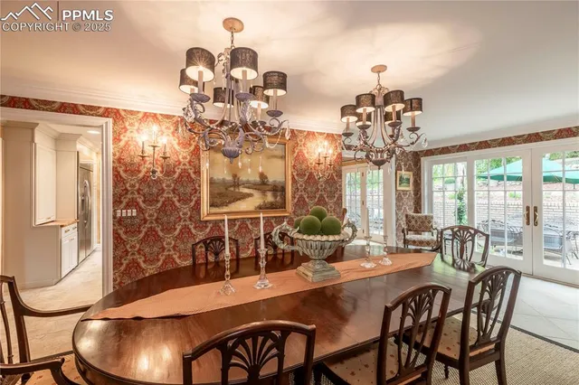 a kitchen with cabinets and chairs