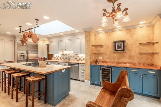 a kitchen with a stove a refrigerator and a dining table