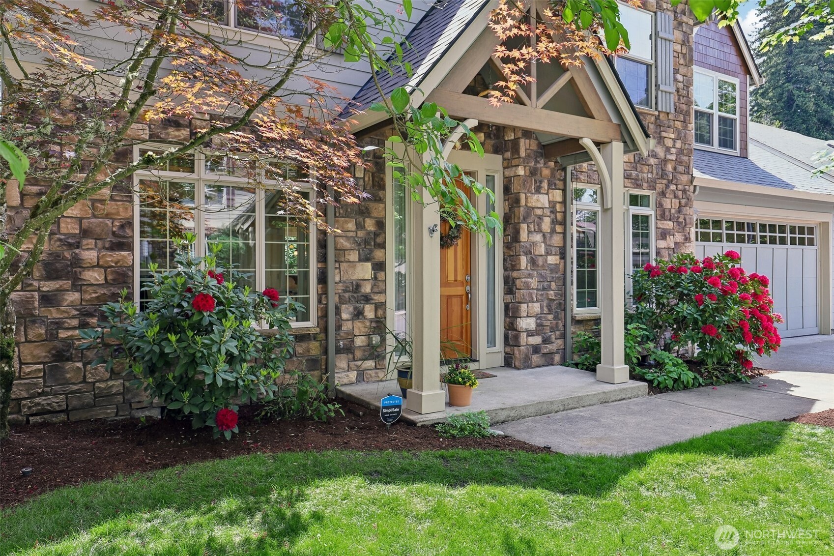 19709 Southeast 26th Way Camas, WA 98607 - Photo 1 of 36 a view of a house with a small yard and a flower garden