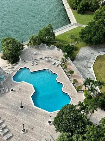 an aerial view of a house with outdoor space