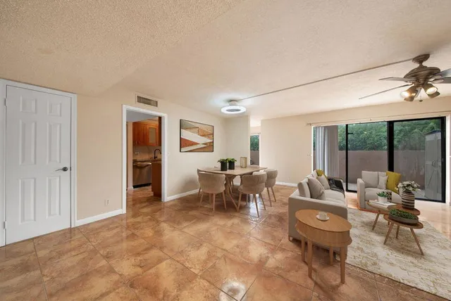 a living room with furniture and a table