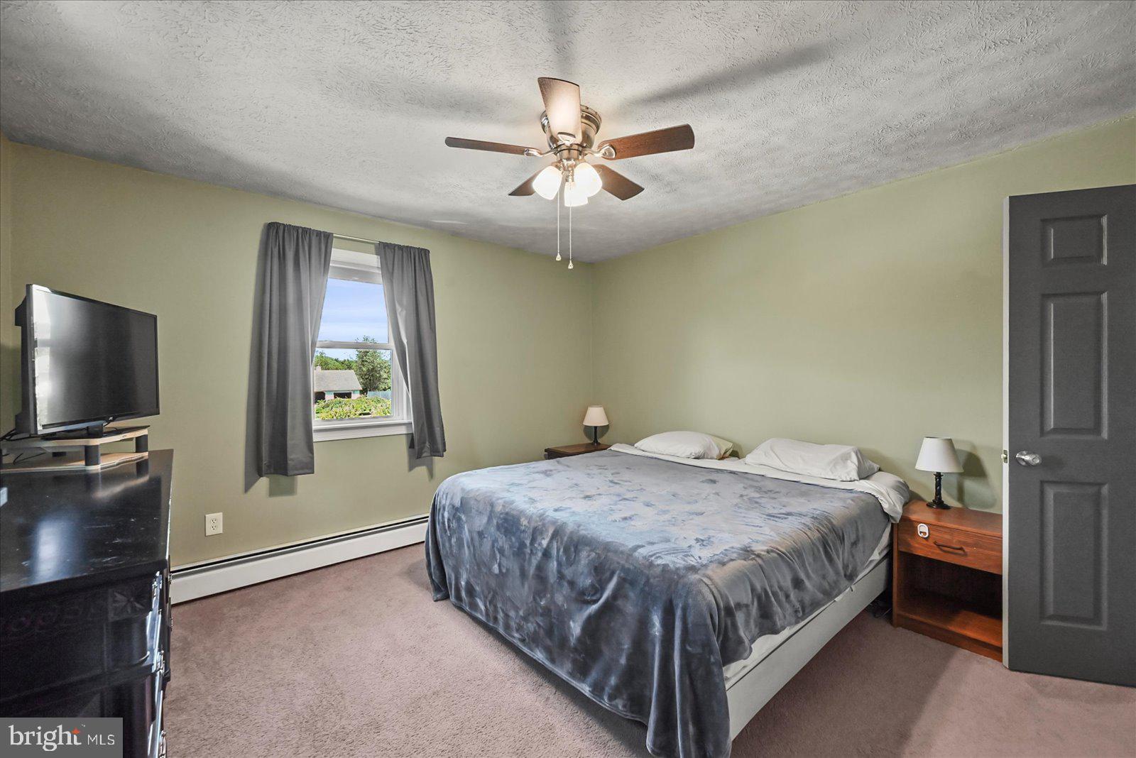 253 Kindig Road Littlestown, PA 17340 - Photo 18 of 41 Cozy bedroom with serene views.